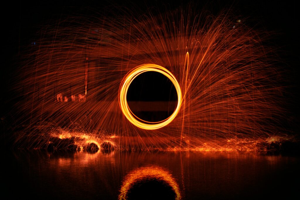 Stunning Glowing Circular Pattern Wallpaper with Fiery Sparks