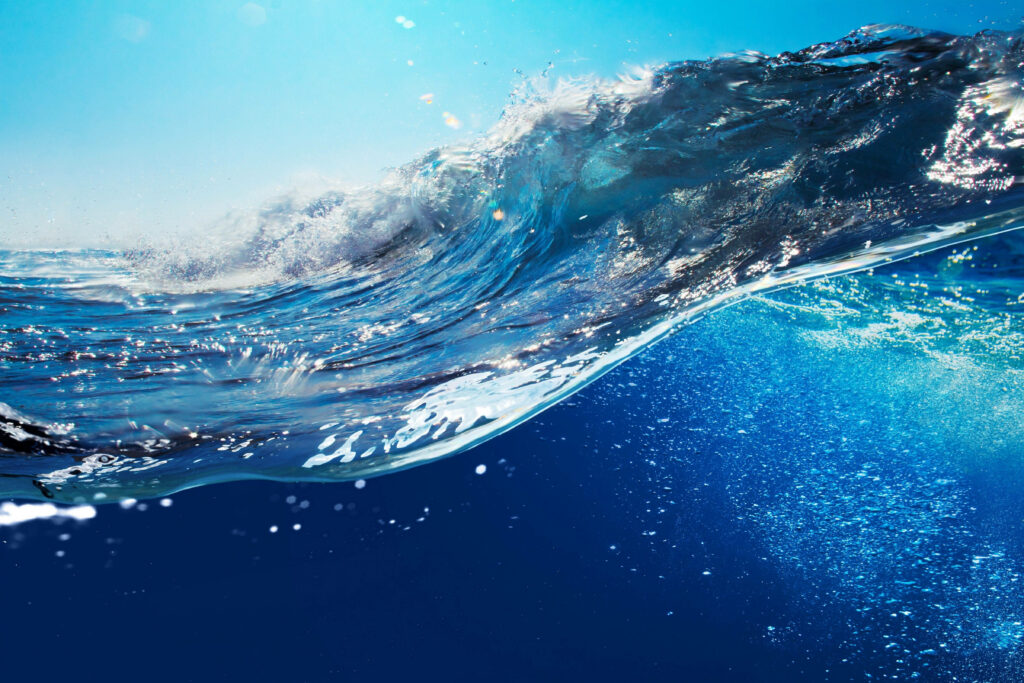 Oceanic Majesty: Mesmerizing Celestial Blue Wave Landscape Wallpaper