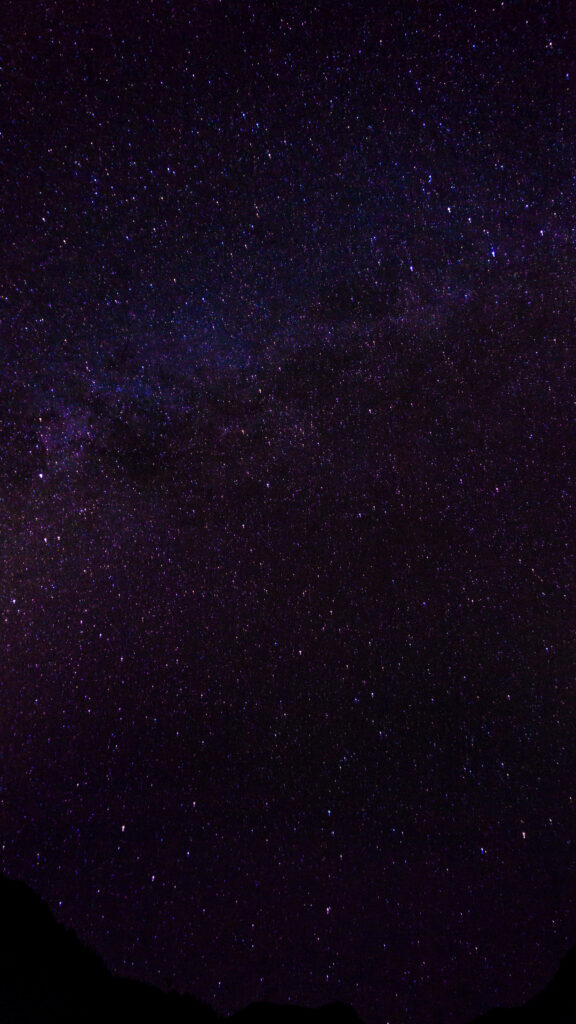 Mesmerizing Dark Purple Galaxy Wallpaper: Shimmering Stars in Space