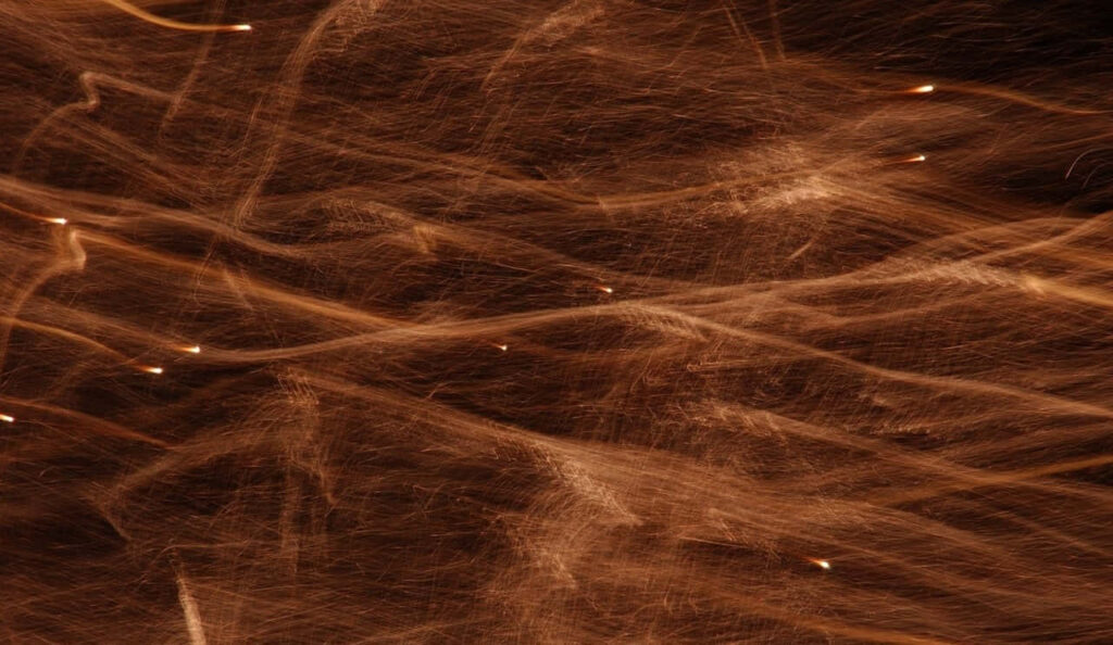 Mesmerizing Brown Textured Wallpaper with Abstract Light Streaks