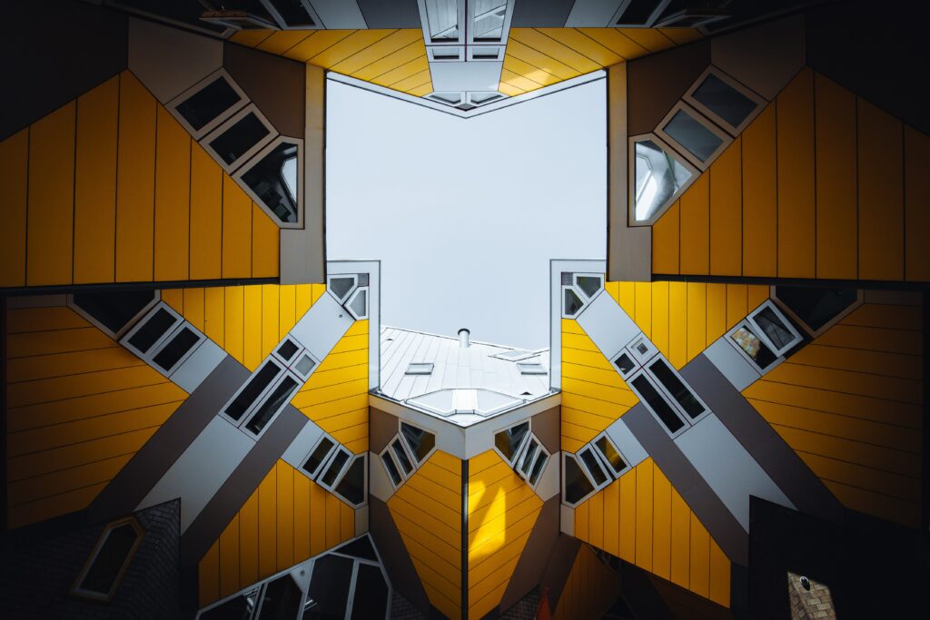 Mesmerizing Geometric Wallpaper: Yellow & Gray Architectural Design
