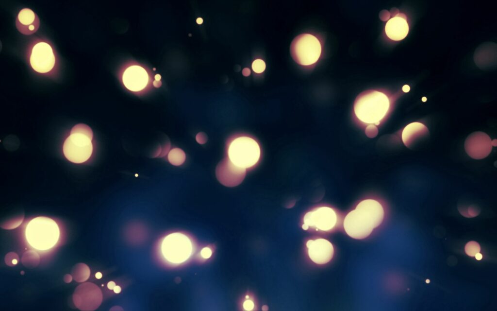 Mesmerizing Glowing Circles Wallpaper - Serene Dark Background