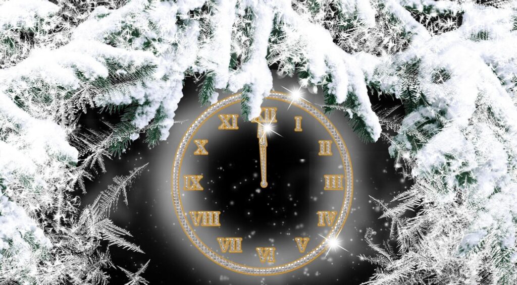 Magical Winter Wallpaper: Golden Clock Dial Amid Snowy Twigs