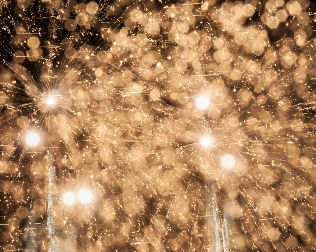 Mesmerizing Golden Fireworks Wallpaper: Sparkling Celebration Background