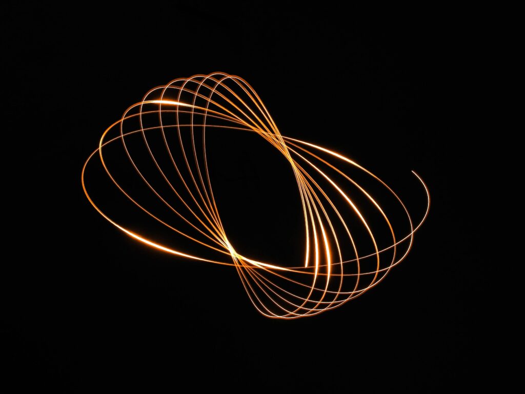 Glowing Golden Rings Wallpaper on Deep Black Background - 4048x3036