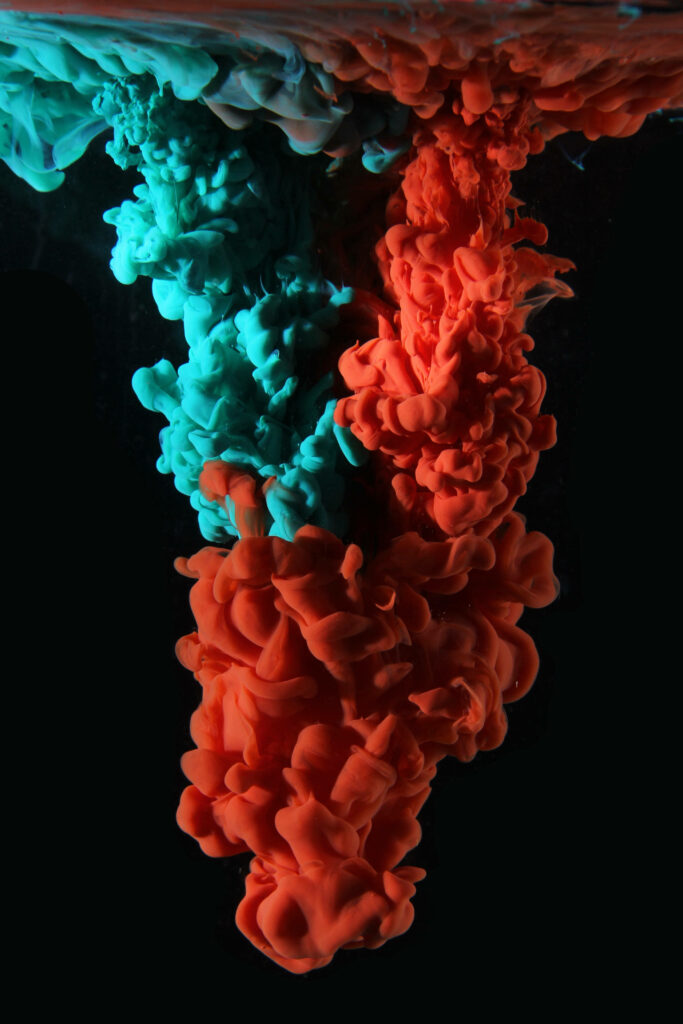 Dreamy Color Fusion: Captivating Turquoise and Orange Paint Merge in Mesmerizing Smoke-like Pattern for a Cool Phone Wallpaper
