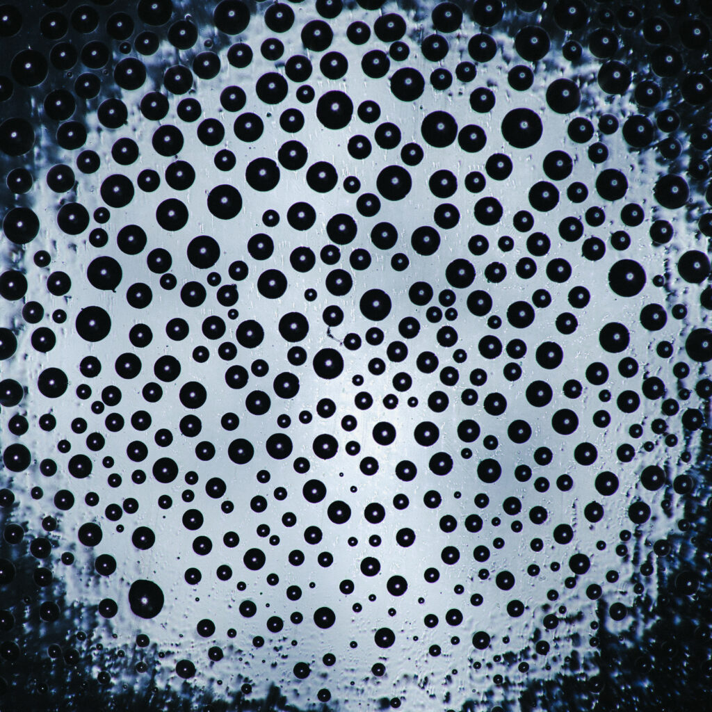 Mesmerizing Macro Bubble Wallpaper: Intricate Water Dynamics Background