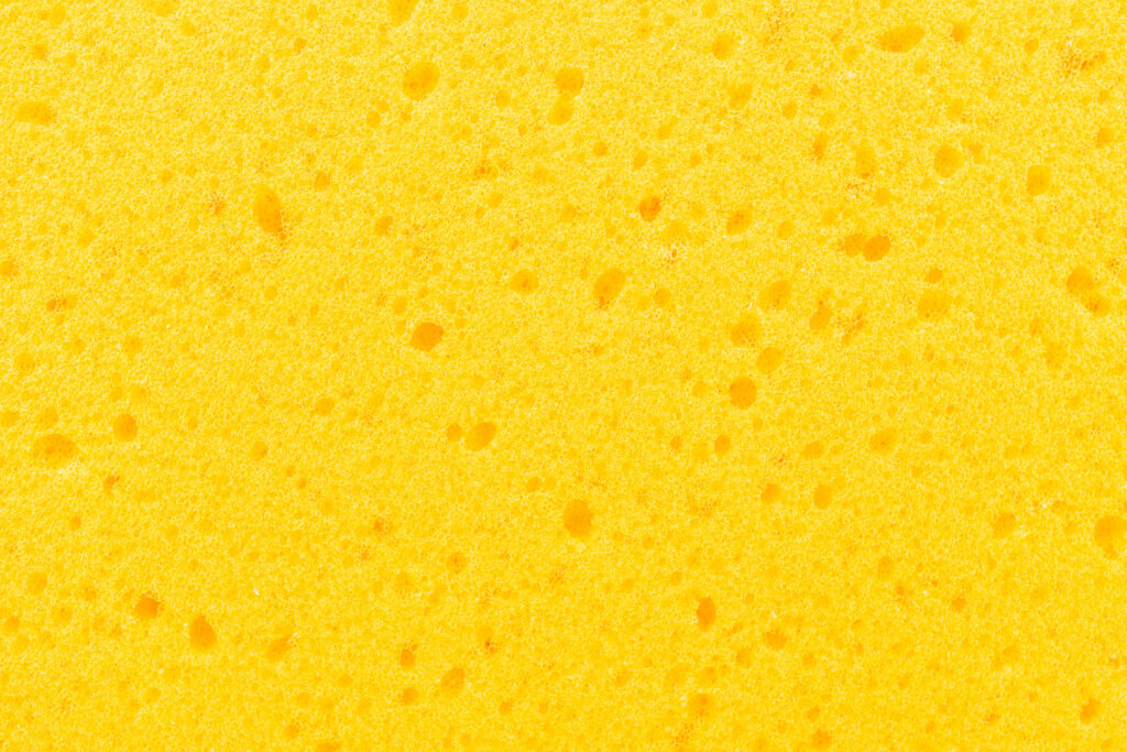 Captivating Macro Shot: A Stunning Sponge Texture in Vibrant Yellow - HD Background Wallpaper