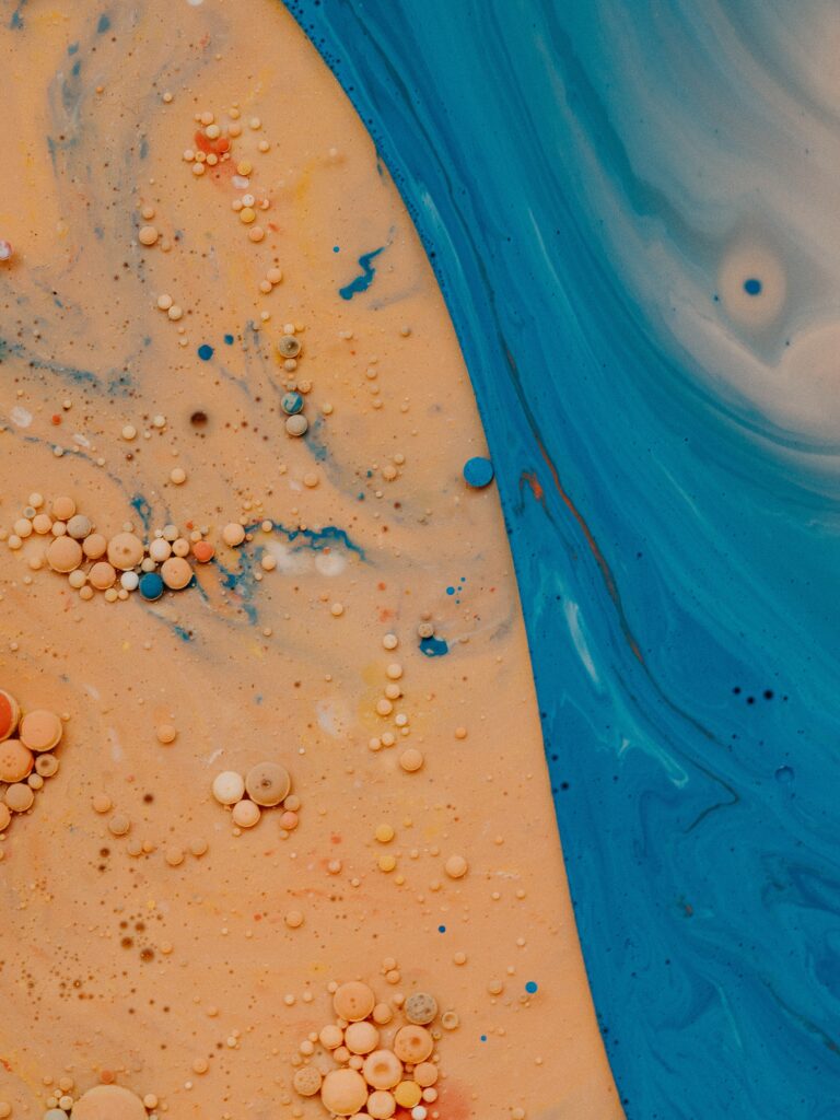 Mesmerizing Macro Liquid Paint Wallpaper: Yellow & Blue Abstract Background
