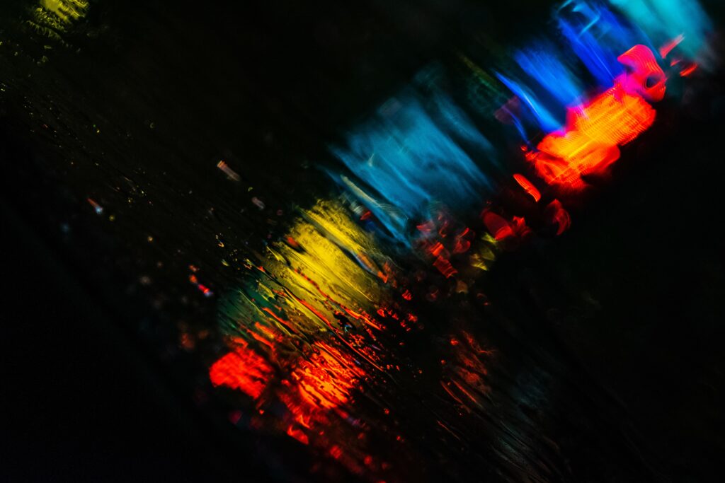 Vibrant Macro Raindrop Wallpaper with Blurred Colorful Lights