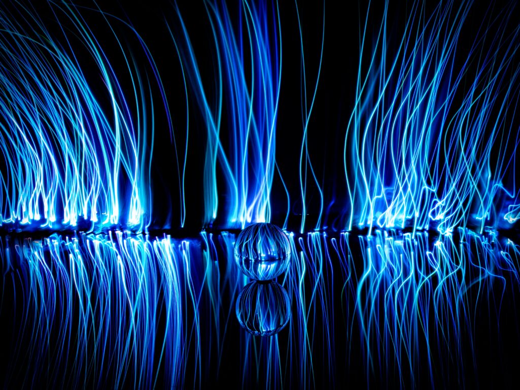 Mesmerizing Neon Blue Light Streaks Digital Wallpaper Background