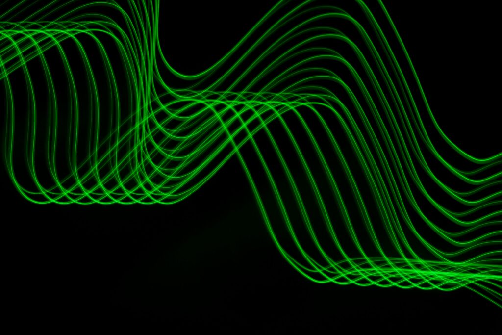 Dynamic Neon Green Lines on Black Background - Mesmerizing Wallpaper