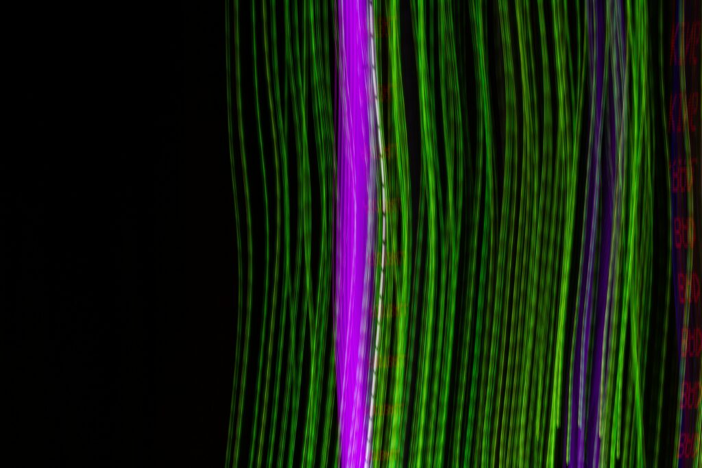 Mesmerizing Neon Green & Purple Abstract Background Wallpaper