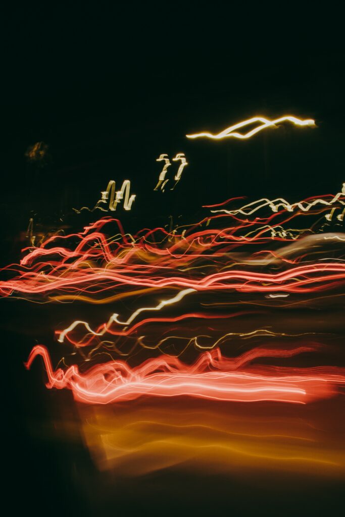 Mesmerizing Neon Light Trails Wallpaper: Abstract Dark Background