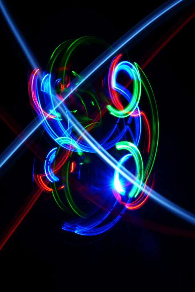 Vibrant Neon Lights: Long-Exposure Abstract Digital Wallpaper