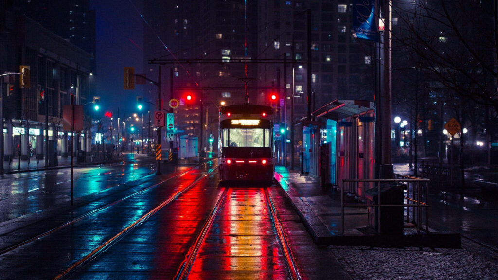 Tranquil Night Cityscape Wallpaper: Neon Lights & Reflections