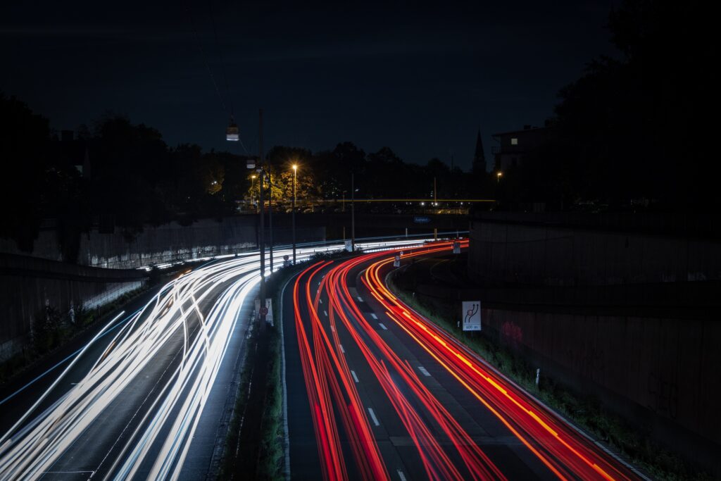 Vibrant Night Road Scene with Light Trails - Dynamic Wallpaper