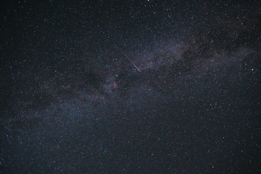 Stunning Star-Filled Night Sky Wallpaper with Radiant Starfall