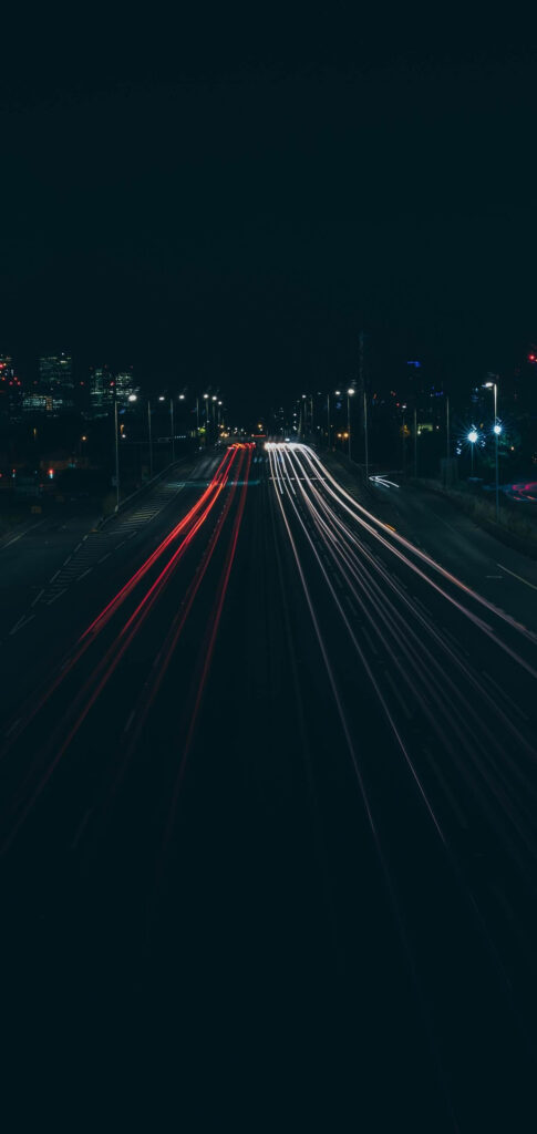 Vibrant Night-Time Wallpaper: Illuminated Road & Cityscape