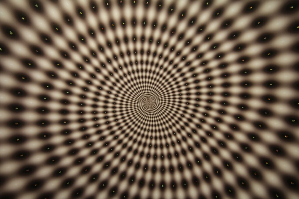 Mesmerizing Optical Illusion Wallpaper: Spiraling Depth Background