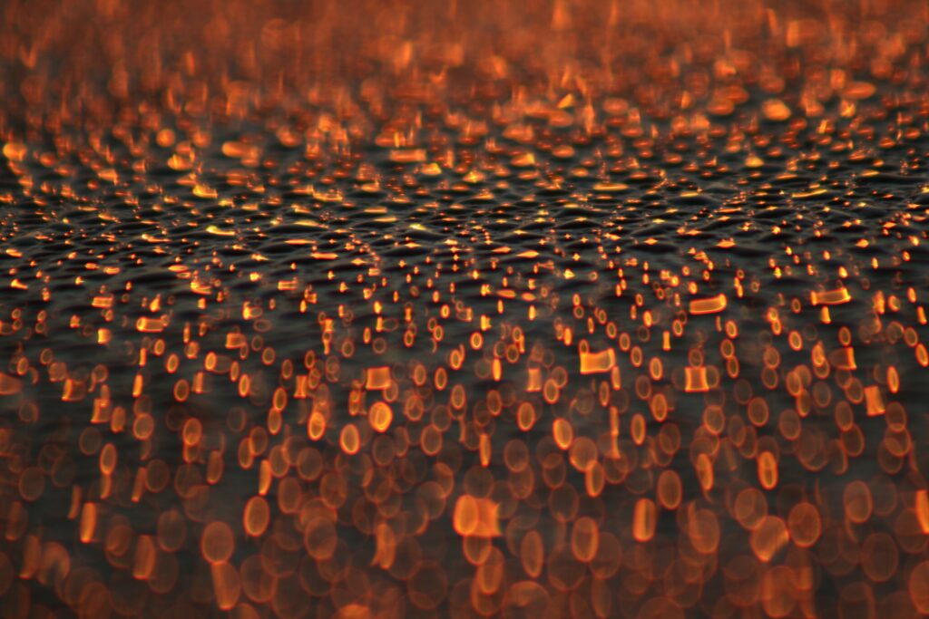 Captivating Orange Bokeh Macro Wallpaper Background with Gentle Glare