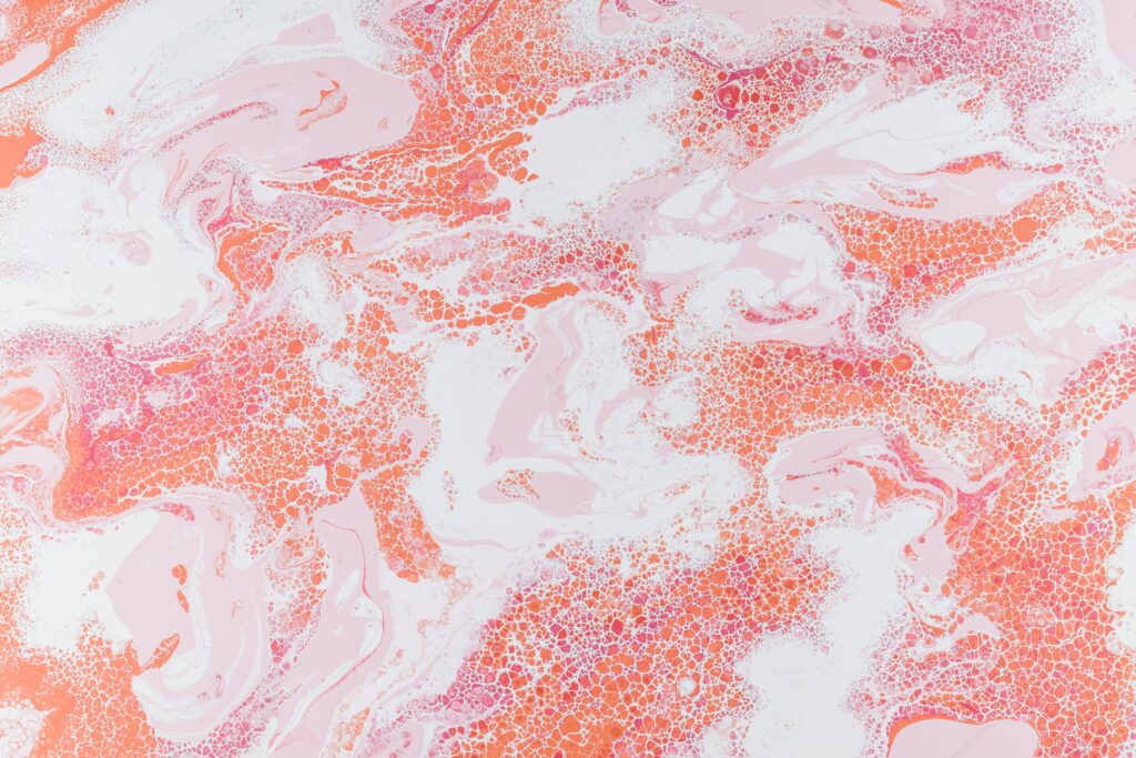 Mesmerizing Abstract Wallpaper: Swirling Pink and Orange Patterns