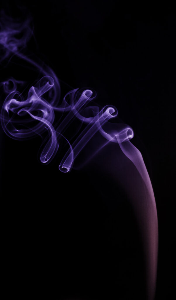 Mesmerizing Purple Smoke Dance on Deep Black Background Wallpaper
