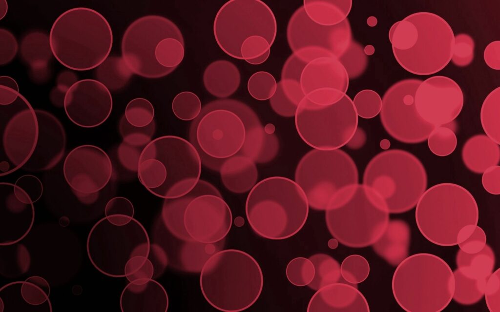 Mesmerizing Abstract Red Circles Wallpaper - Dark Background Design