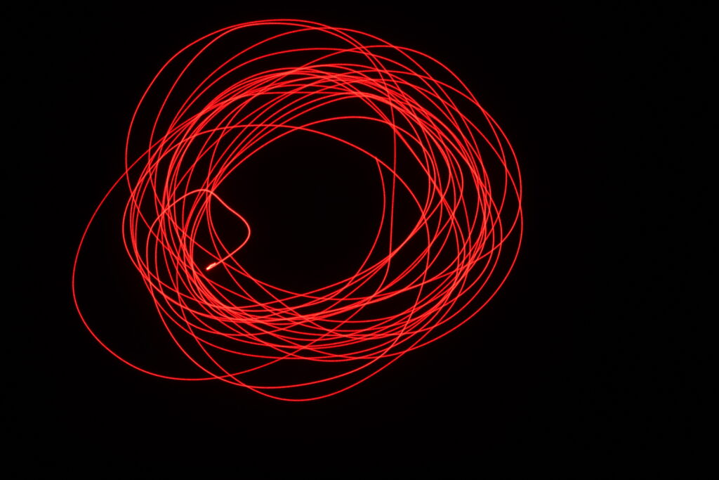 Abstract Red Lines Circle on Black Background - Captivating Wallpaper