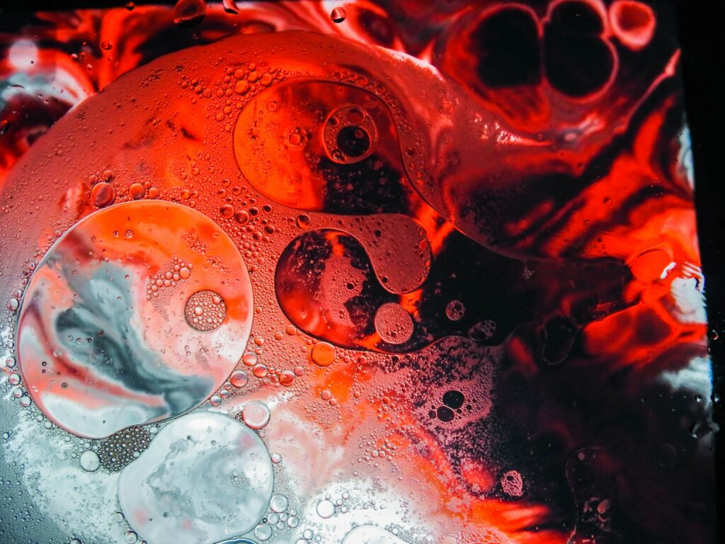 Red-Tinted Foam and Bubbles: Abstract High-Resolution Wallpaper