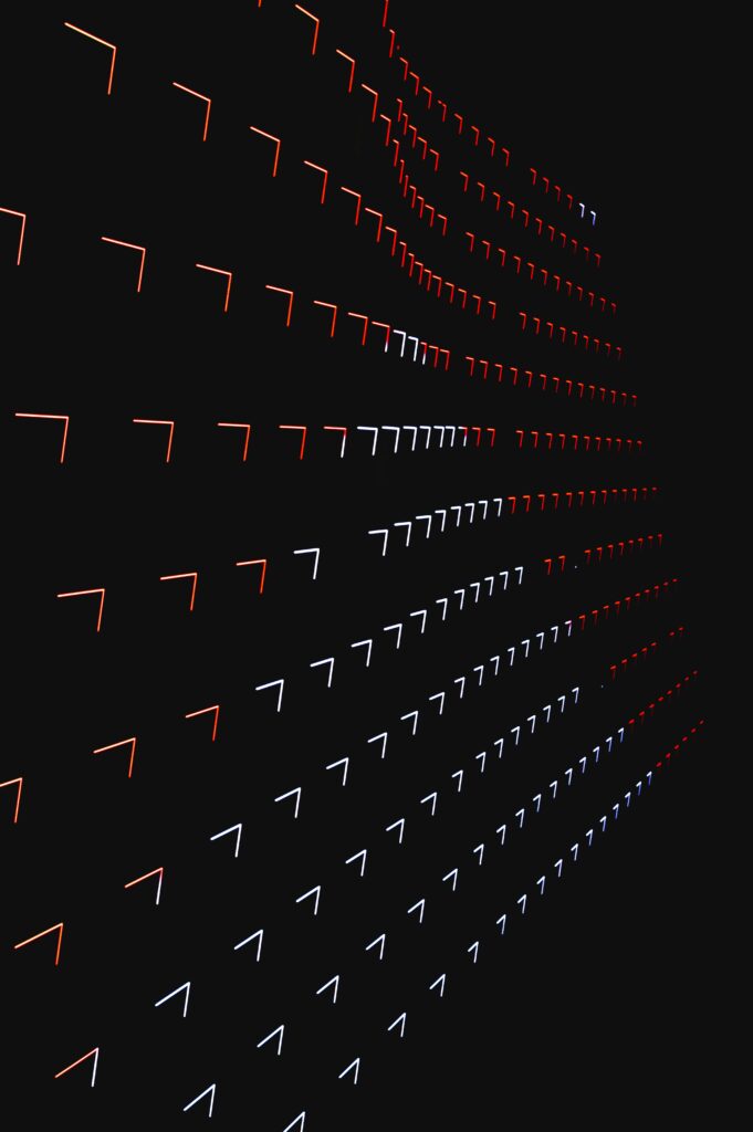 Dynamic Geometric Wallpaper: Glowing Red, White & Blue Lights