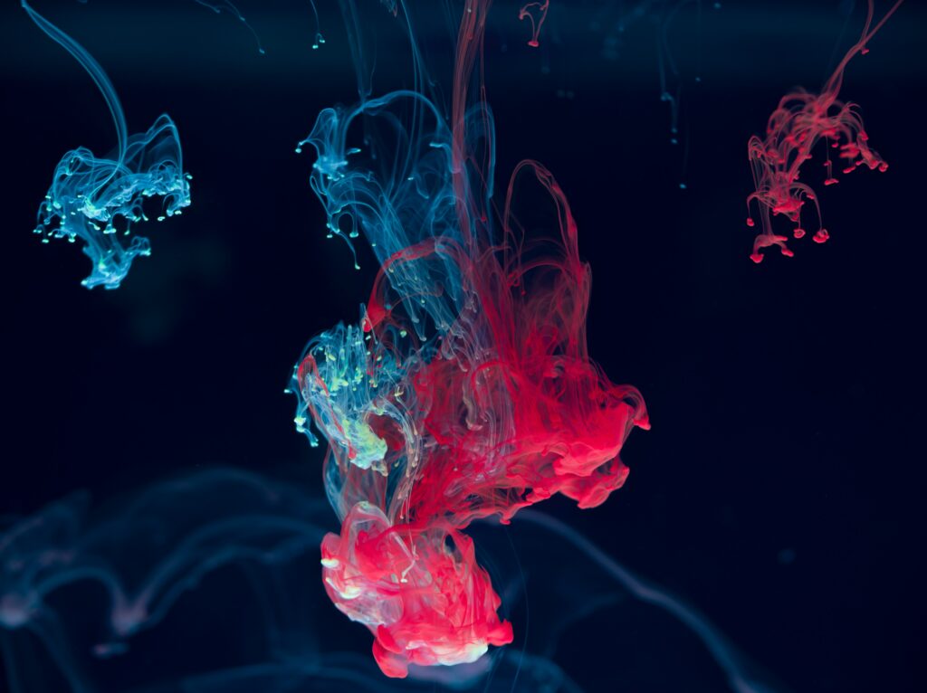 Fluid Red and Blue Ink Art: Ethereal Wallpaper Background