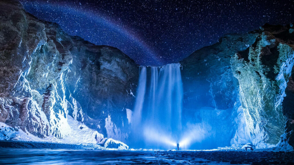 Stunning Skógafoss Waterfall HD Wallpaper under Stars & Rainbow