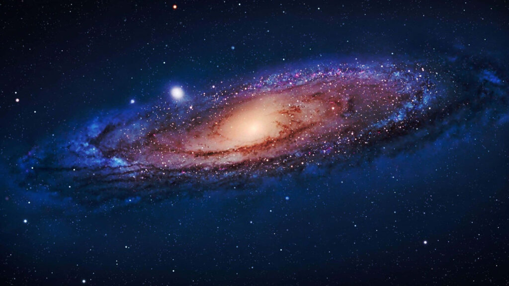 Mesmerizing spiral galaxy wallpaper with vibrant cosmic colors and countless stars.
