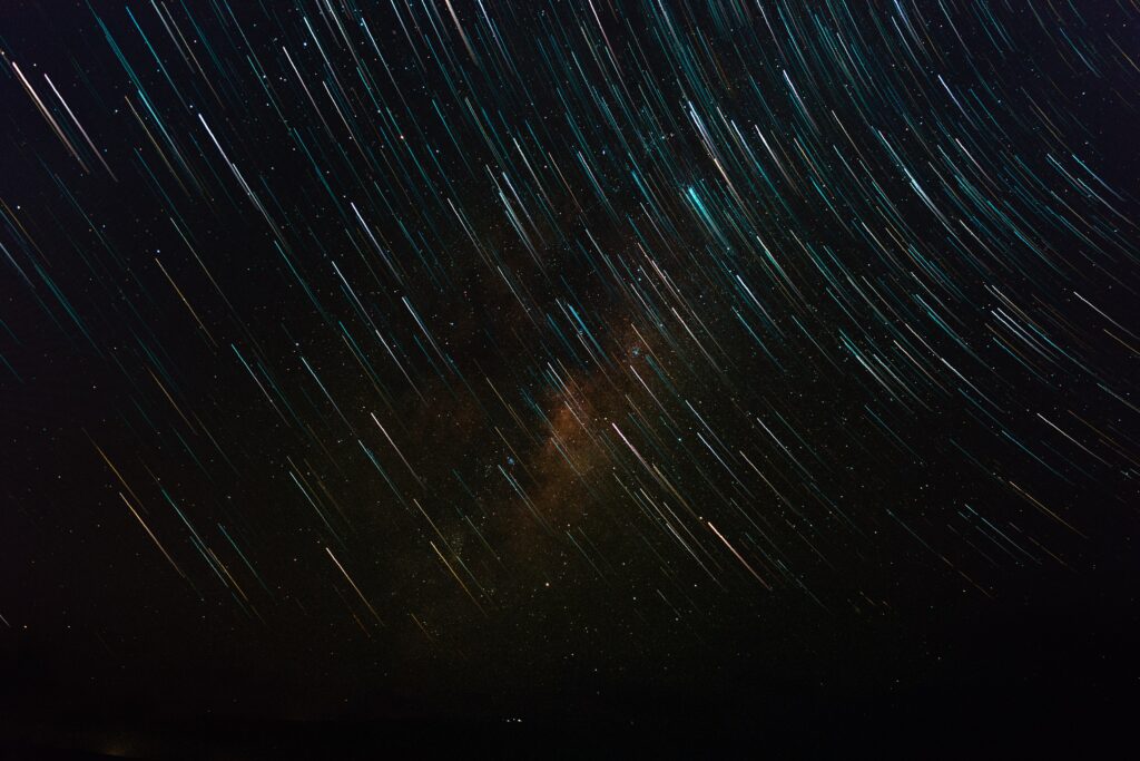 Mesmerizing Starry Sky Wallpaper Background with Shining Streaks