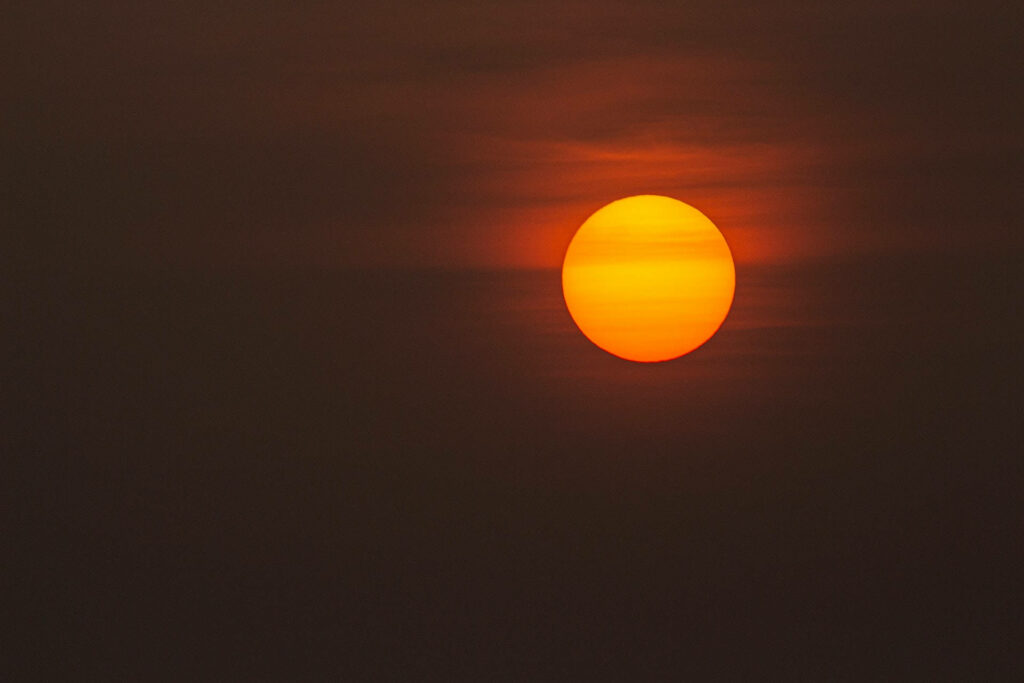 Blazing Sunset Wallpaper: Serene Full-Screen Desktop Background