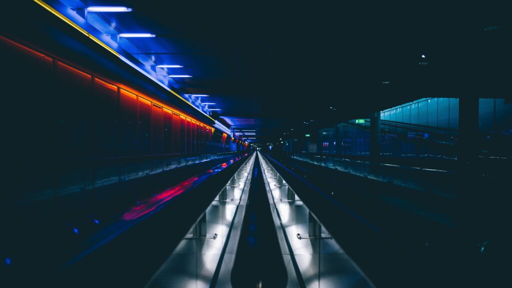 Vibrant Neon Tunnel Wallpaper: Futuristic Underground Scene