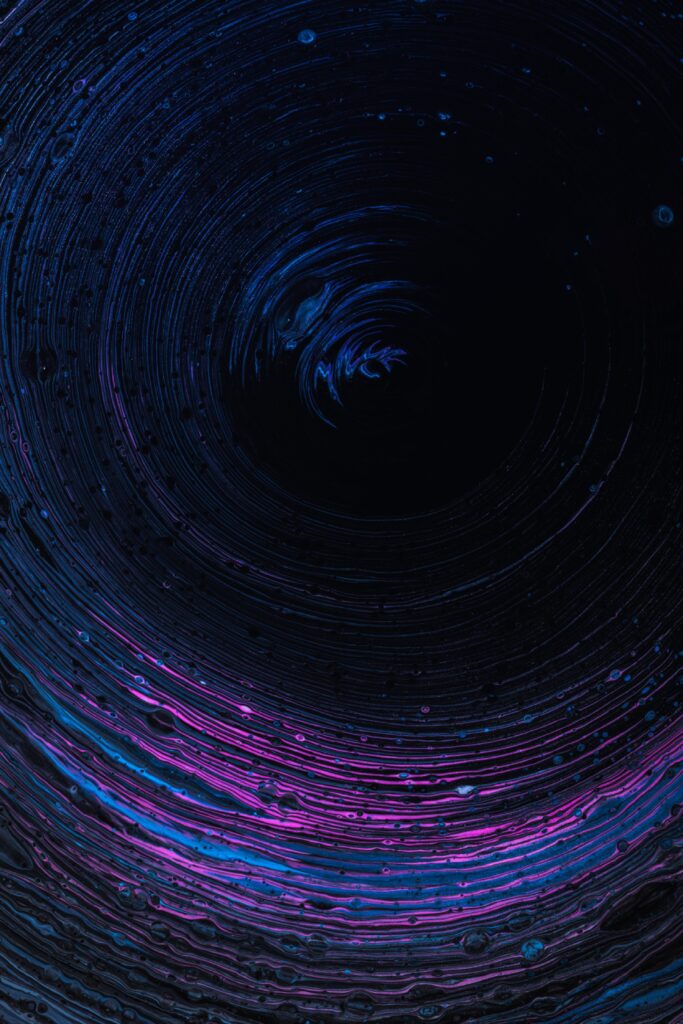 Mesmerizing Vortex Wallpaper: Dark Blue & Purple Design for Depth