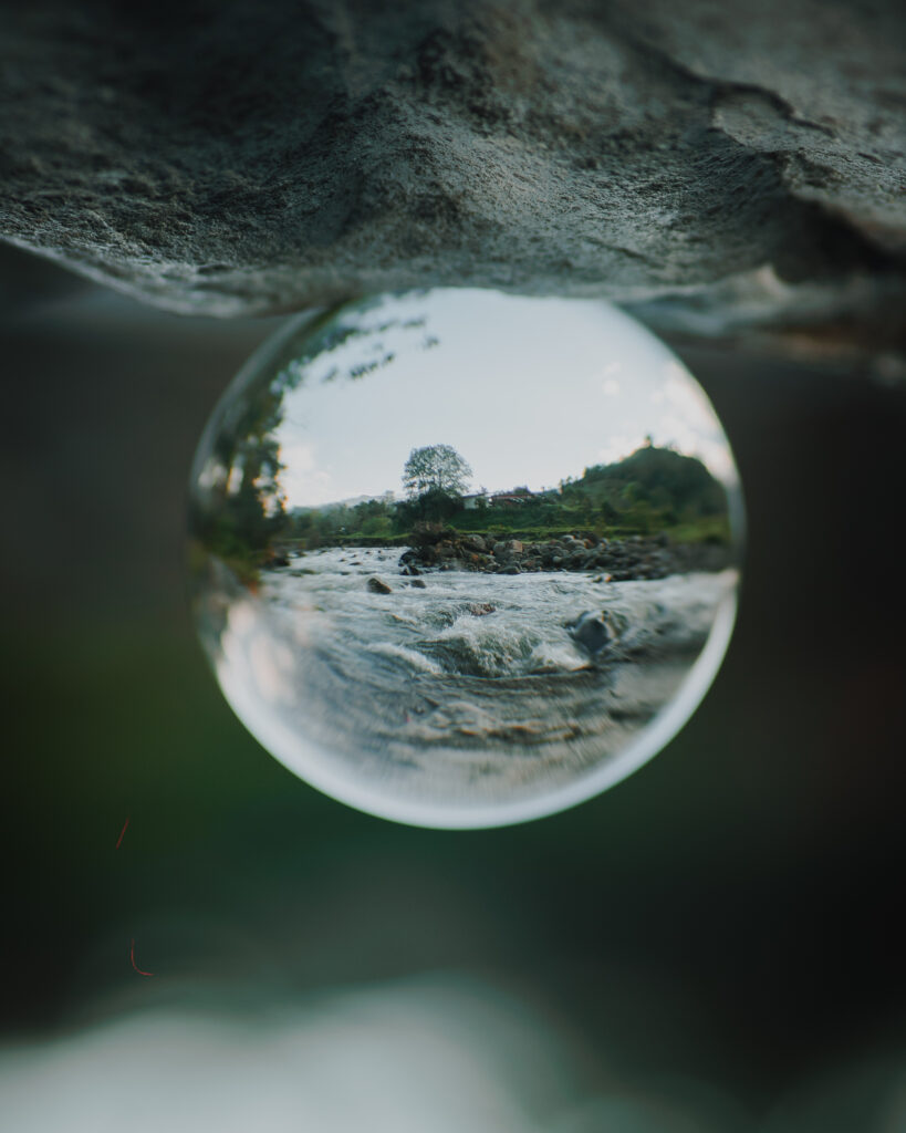 Tranquil River Reflections: Nature-Inspired Crystal Ball Wallpaper