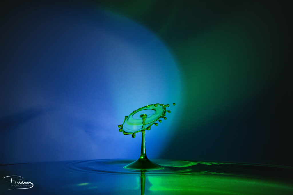 Stunning Water Droplet Splash Wallpaper with Blue & Green Effects