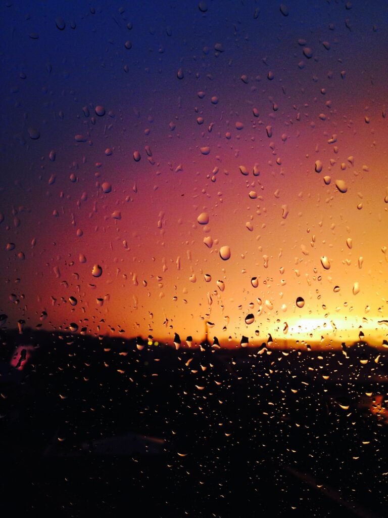 Stunning Water Droplets Wallpaper: Sunset Hues & Blurred Background
