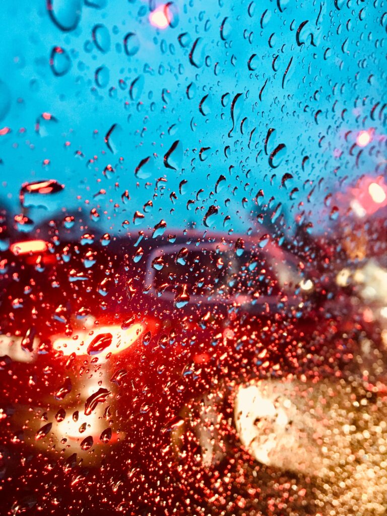Vibrant Water Droplets Wallpaper: Dynamic Colorful Glass Background