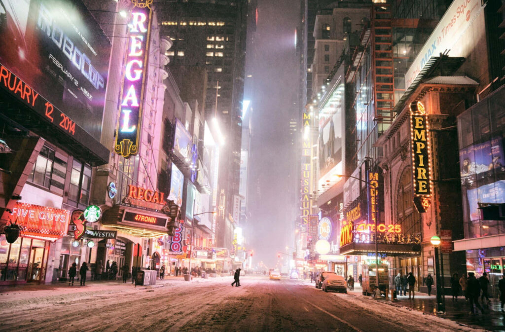 Enchanting Winter Cityscape: Neon Lights & Snowy Streets Wallpaper