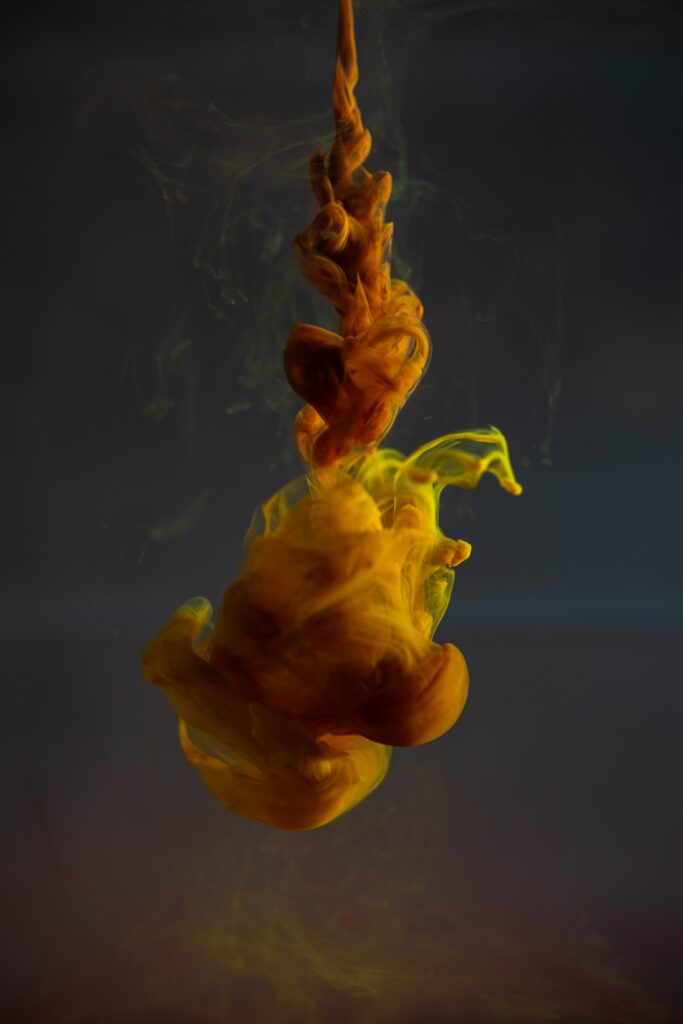 Mesmerizing Yellow Ink Swirl Wallpaper on Dark Background - 3725x5588