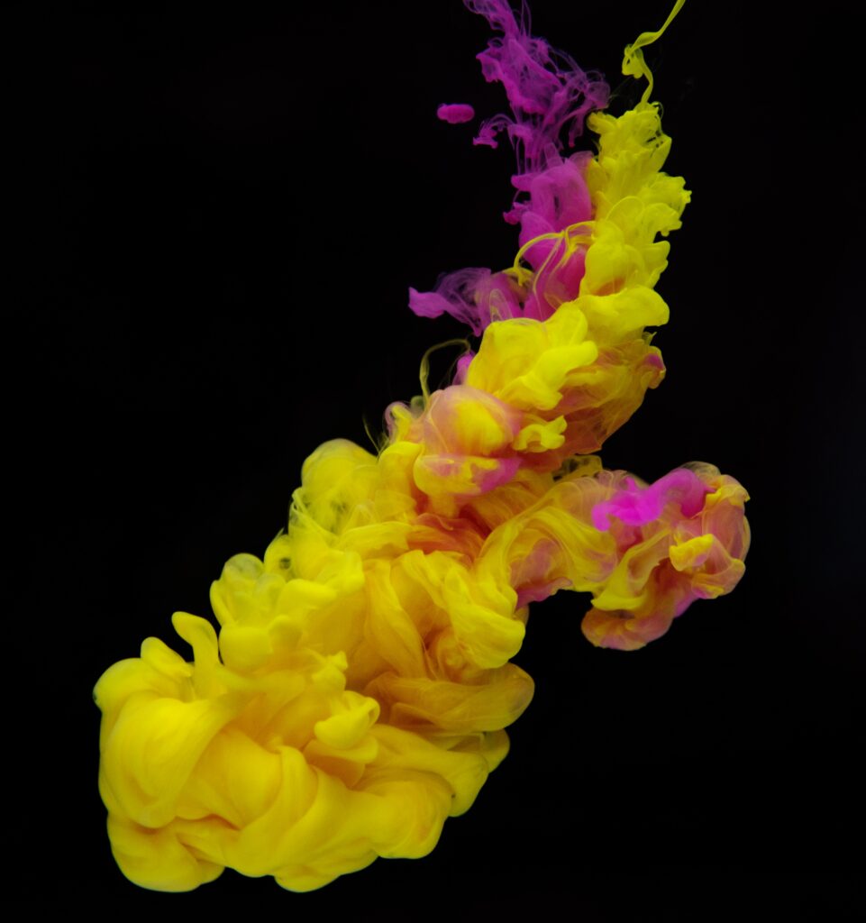 Vivid Yellow & Purple Liquid Paint Wallpaper on Black Background