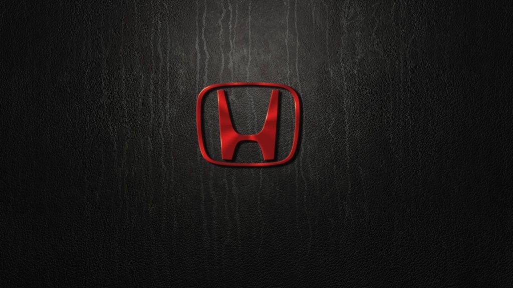 Red metallic Honda logo centered on textured black leather background wallpaper design