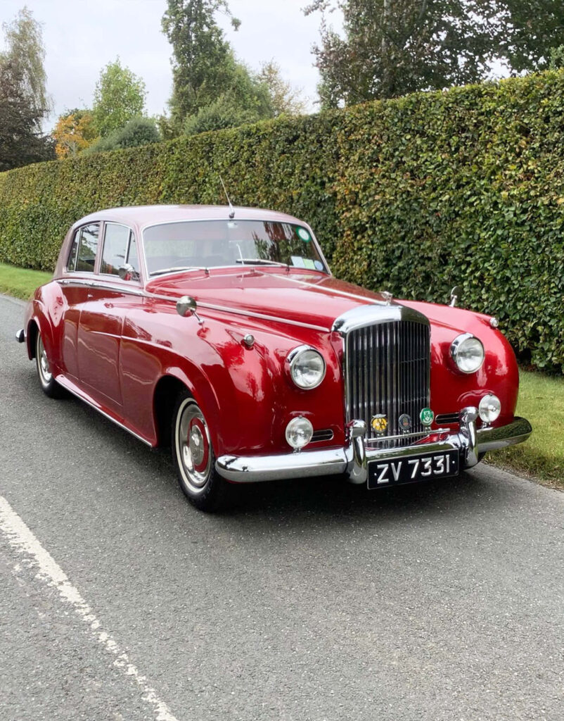 Classic Bentley S2 Showcasing Exquisite Craftsmanship in a Picturesque Surrounding Wallpaper