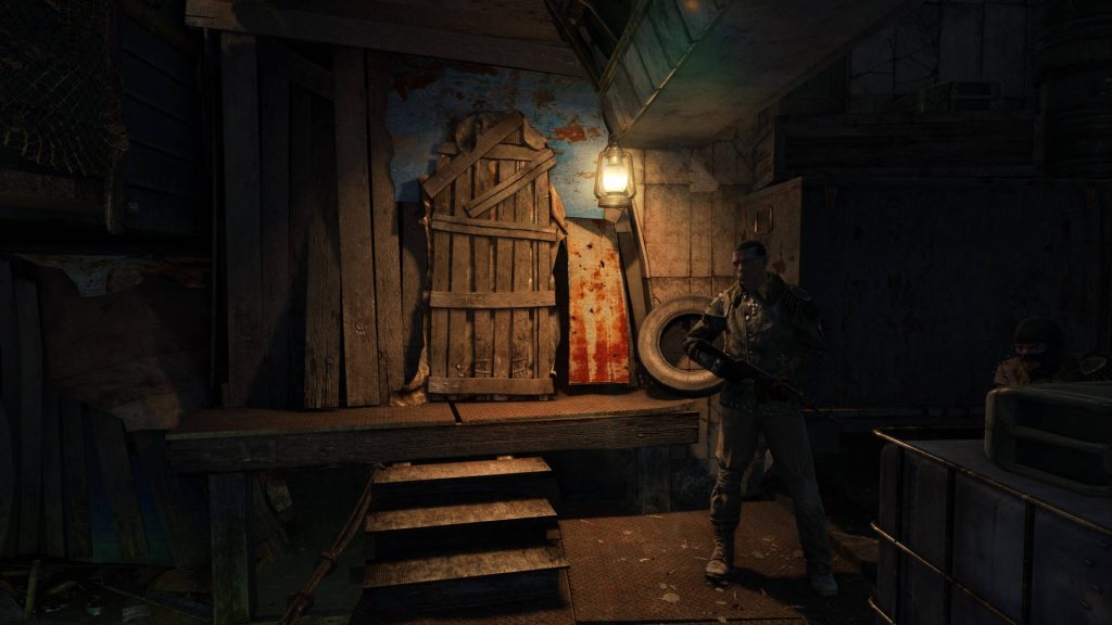Soldier guarding dimly lit safe house in Metro Last Light post-apocalyptic underground scene wallpaper