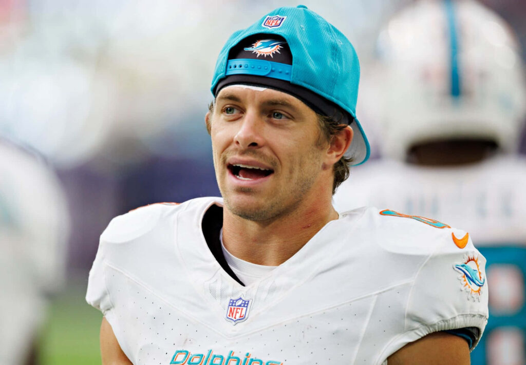 Miami Dolphins Braxton Berrios close-up sideline candid in uniform teal cap vibrant team colors wallpaper