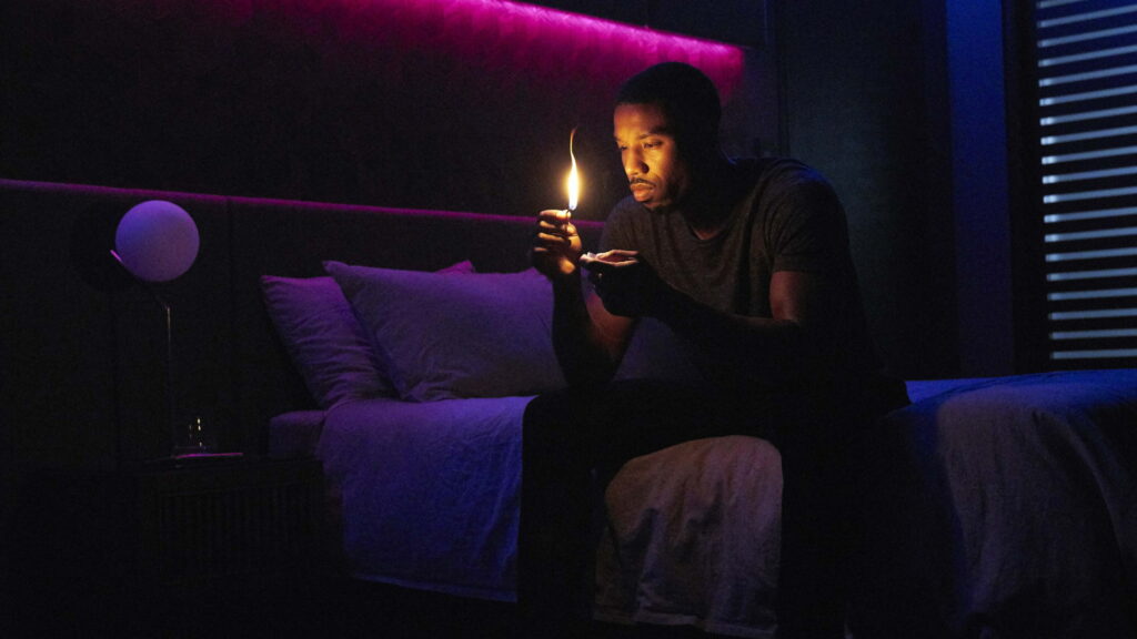 Michael B Jordan as Guy Montag in Fahrenheit 451 neon-lit room 4K cinematic wallpaper